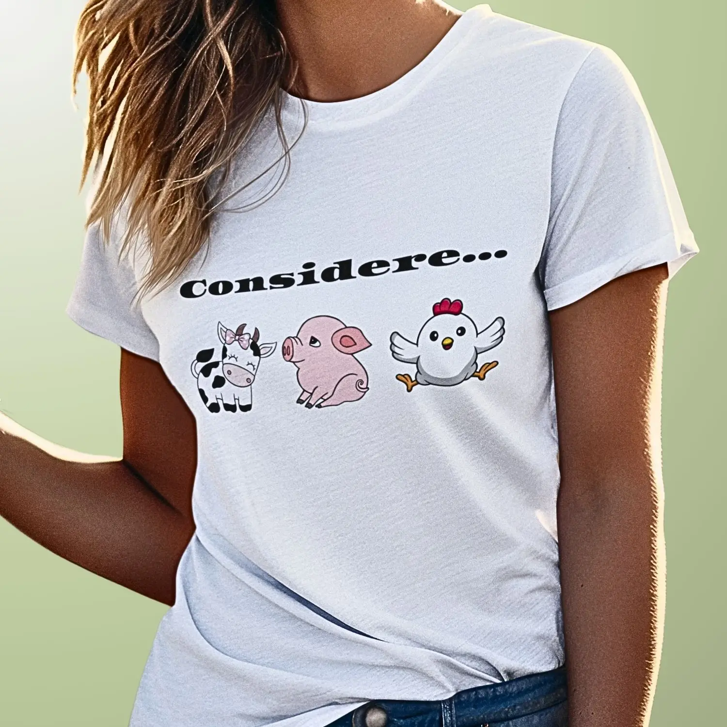 camiseta com alusão ao veganismo através de desenho singelo de uma vaquinha, um porquinho e uma galinha